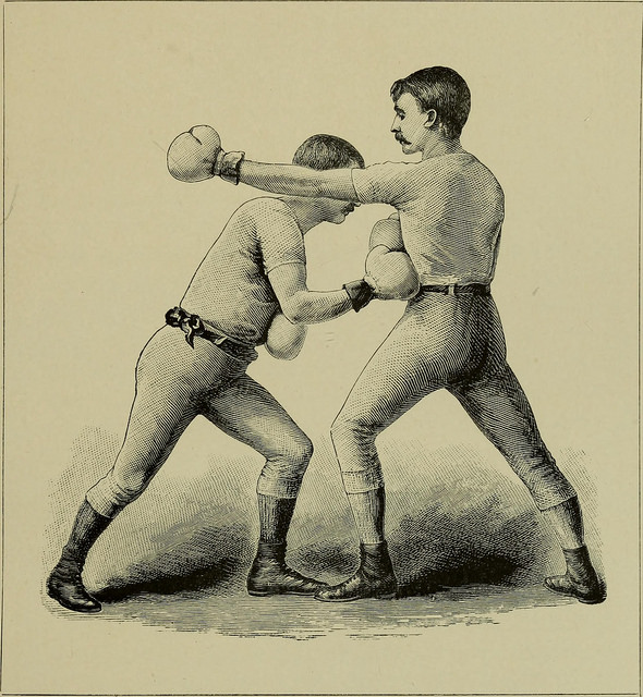 Feinting is common in boxing. Although here the guy on the left seems to just be propping up the guy on the right with his fist.